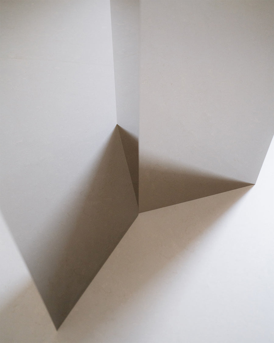 a white box sitting on top of a white wall 