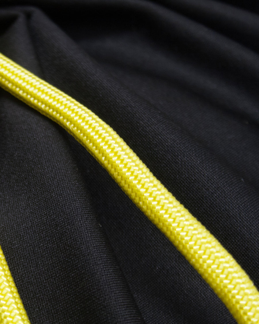 a black tie with a yellow ribbon on it 