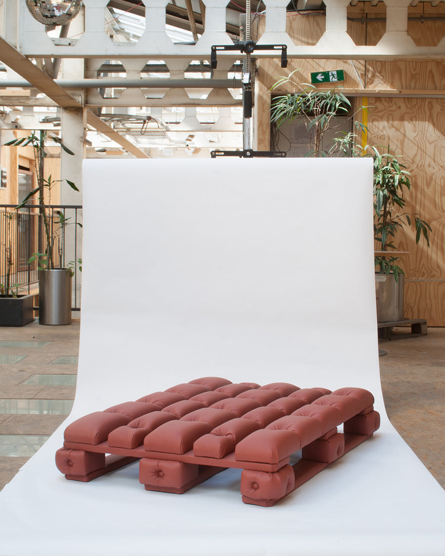 a plate of hot dogs on a table 