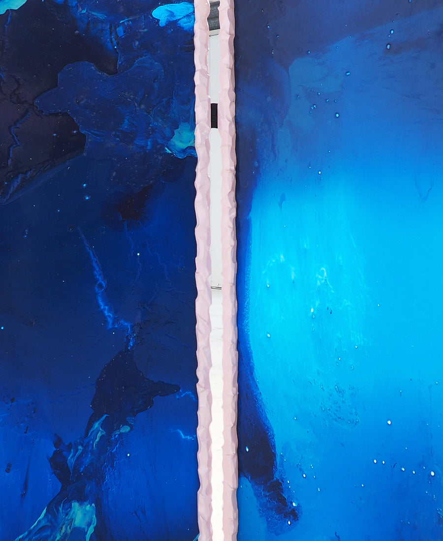 a blue and white street sign on a pole 